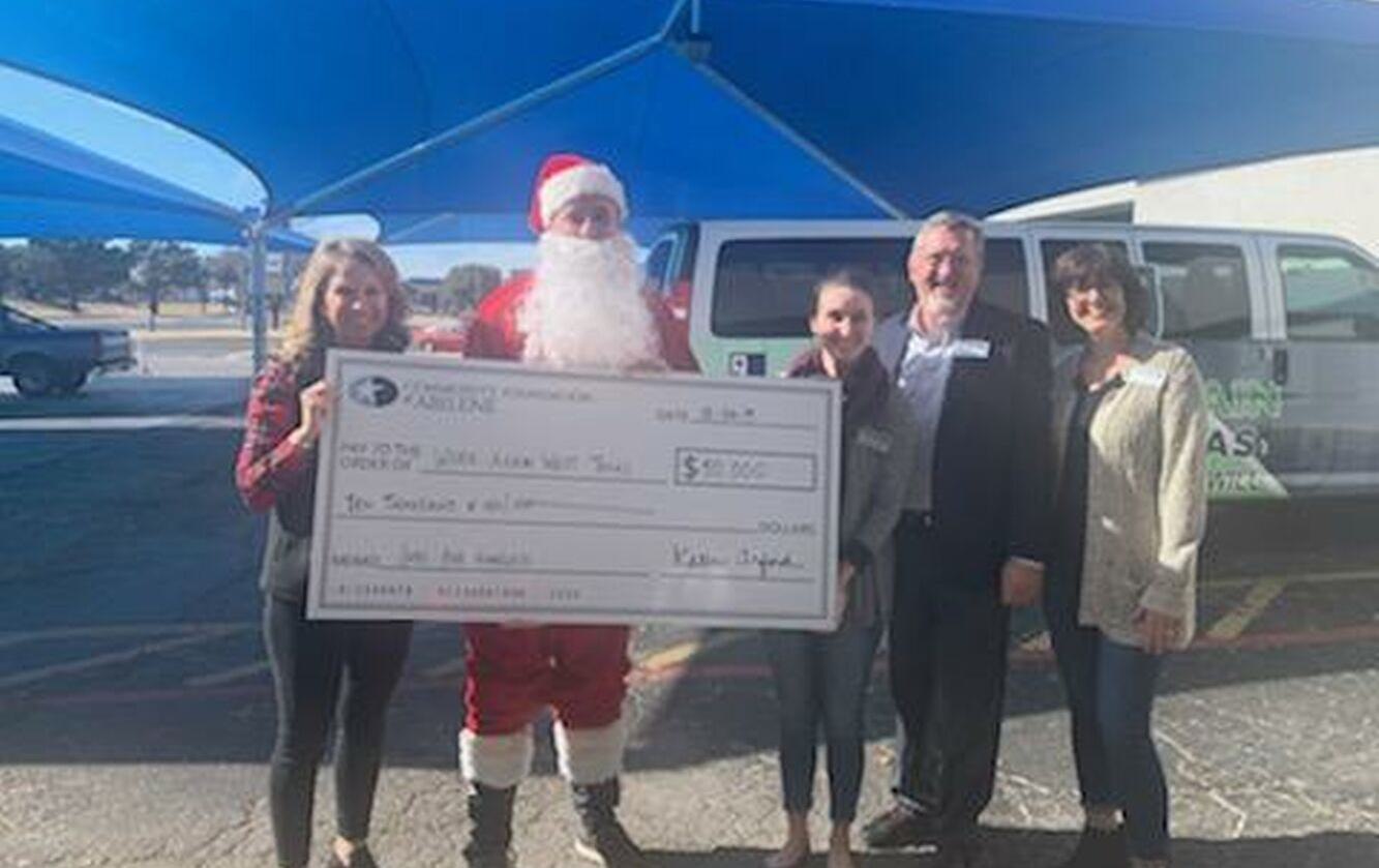 Check From Santa Community Foundation of Abilene - Santa Delivers Checks to Nonprofits